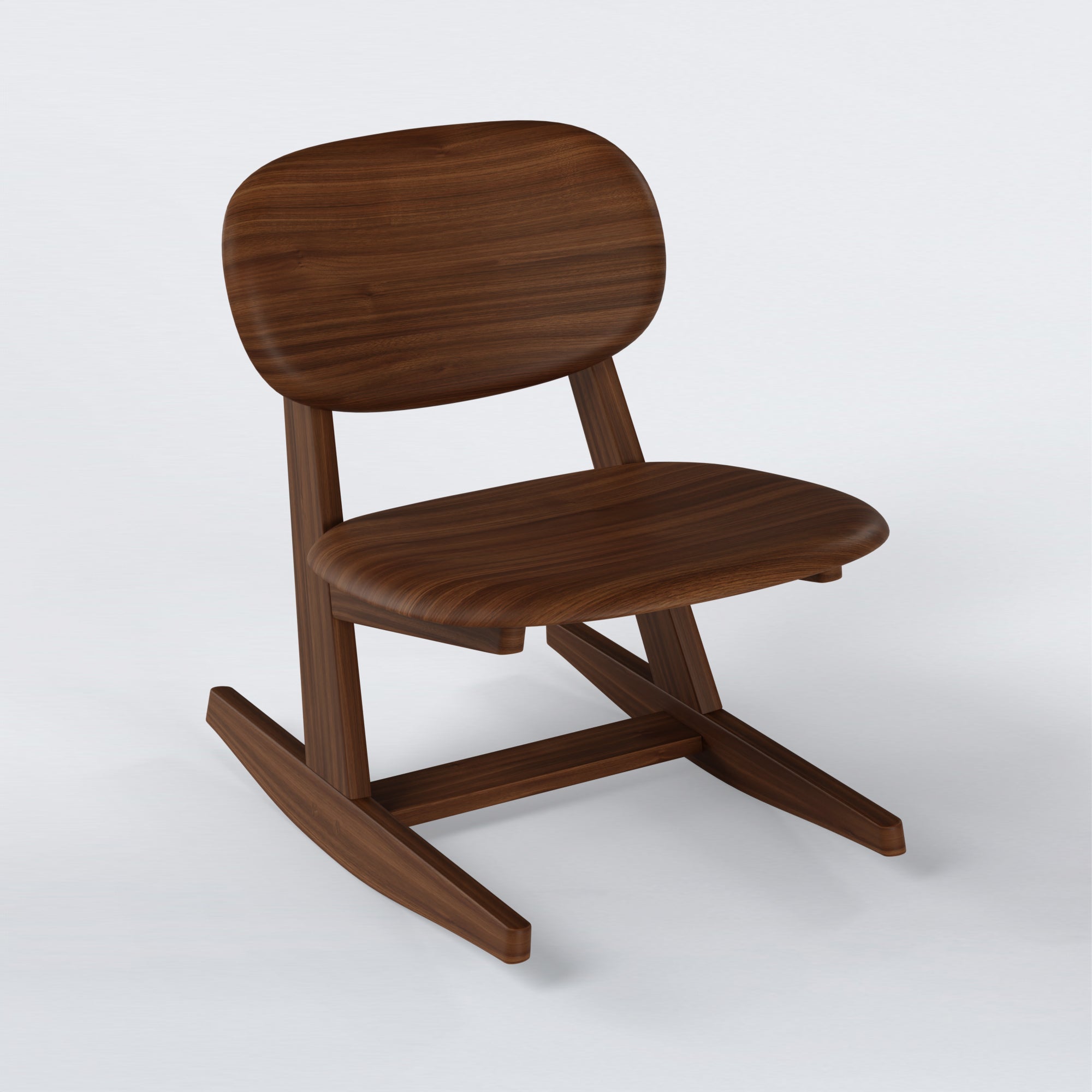 KufenKarl Rocking Chair in walnut – three-quarter view, emphasizing the elegant proportions and sleek frame.