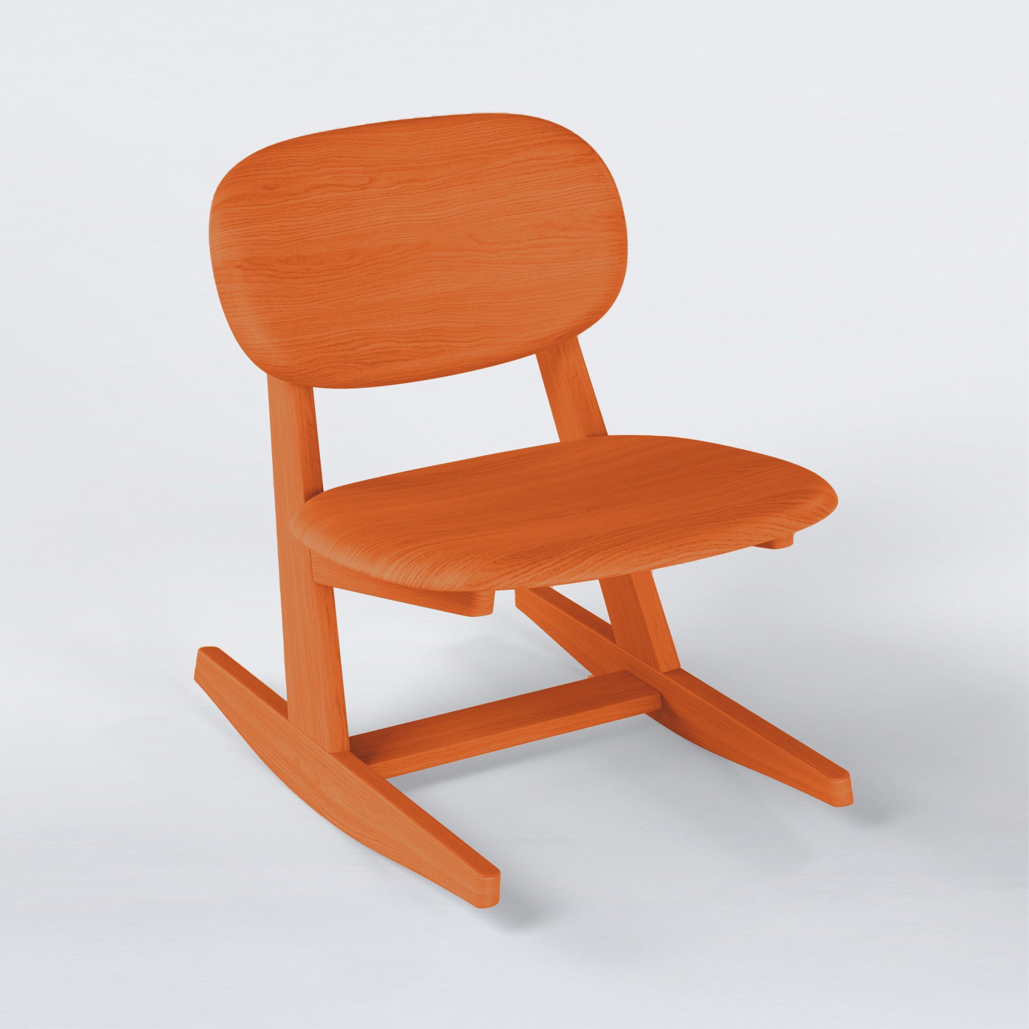 KufenKarl Rocking Chair in orange – warm and sculptural, bringing depth and a dynamic feel to interiors.