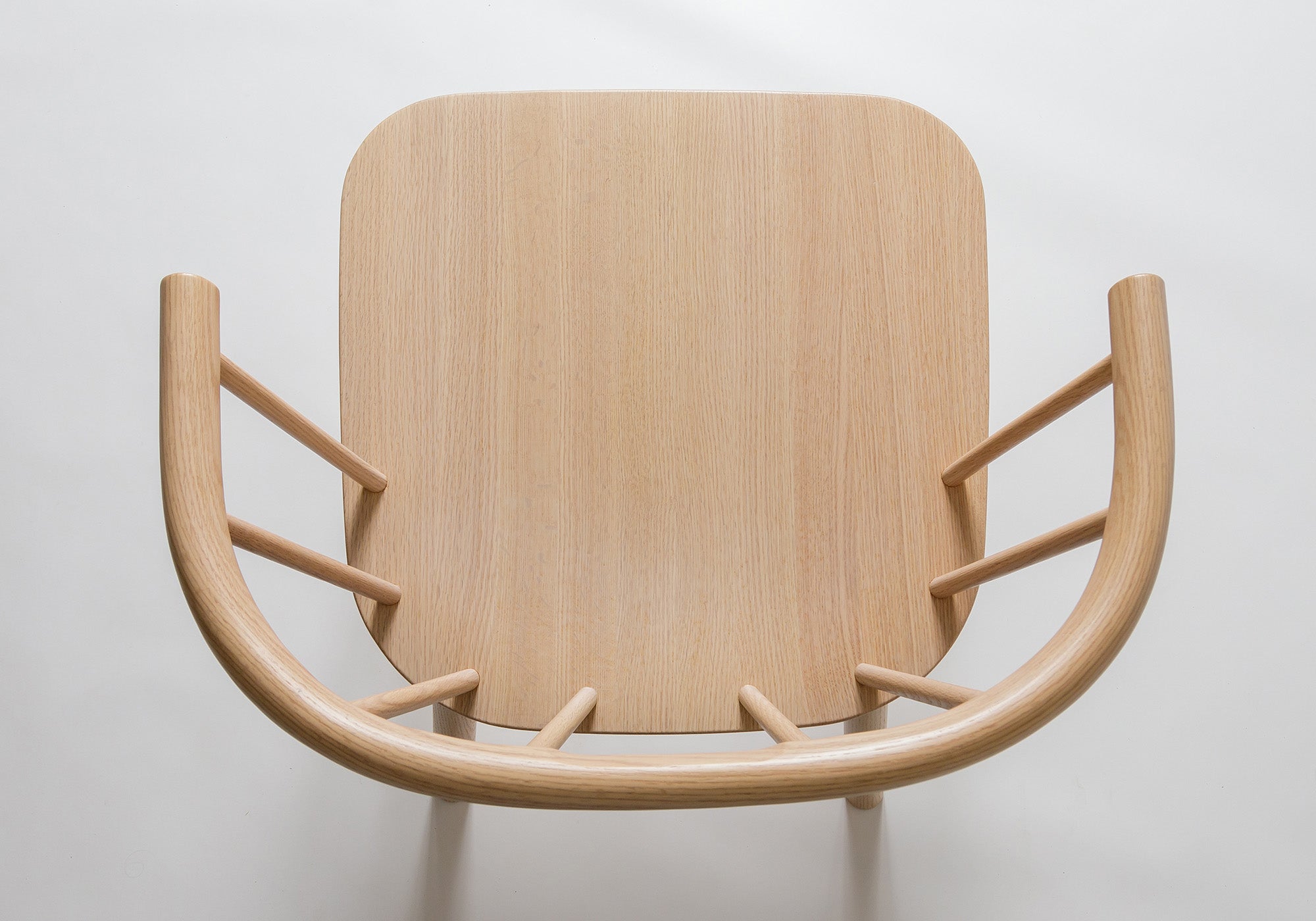 Top-down view of the Studio Lounge Chair, showcasing its sculptural silhouette and ergonomic design.
