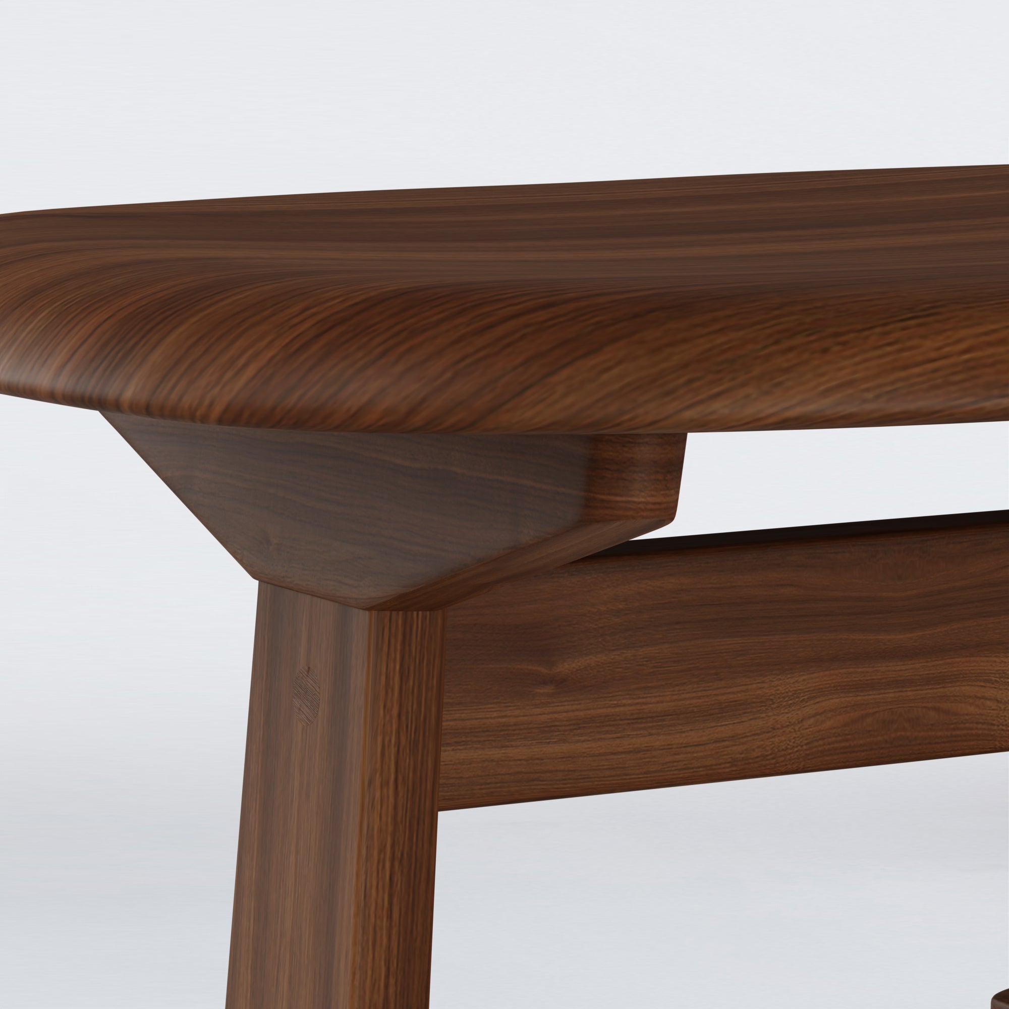 Close-up of KufenKarl Rocking Ottoman in walnut, displaying the fine wood grain and precision joinery.